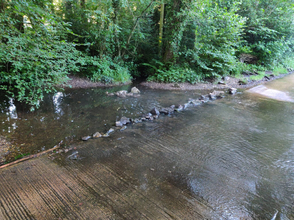 a road river crossing slightly submerged.
