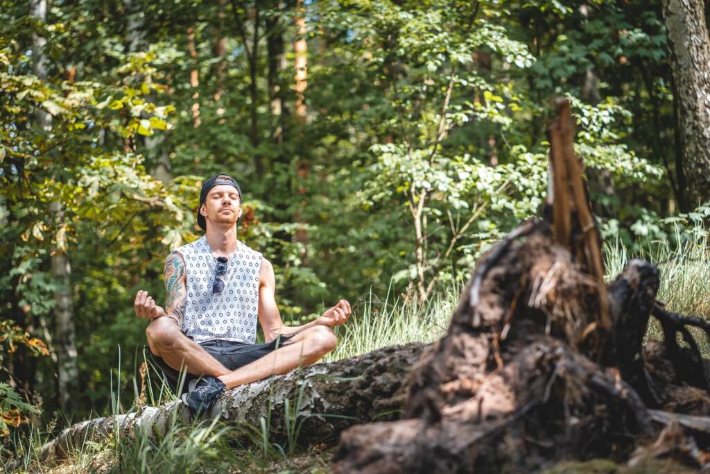 man meditating during a trail run