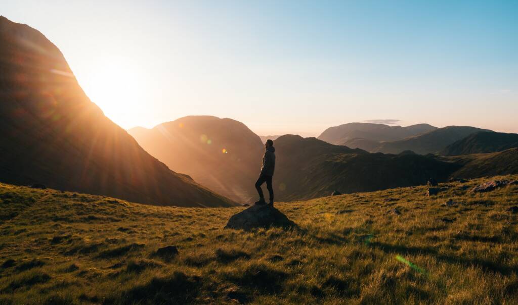 man on a trail with sunset, sensations of freedom.